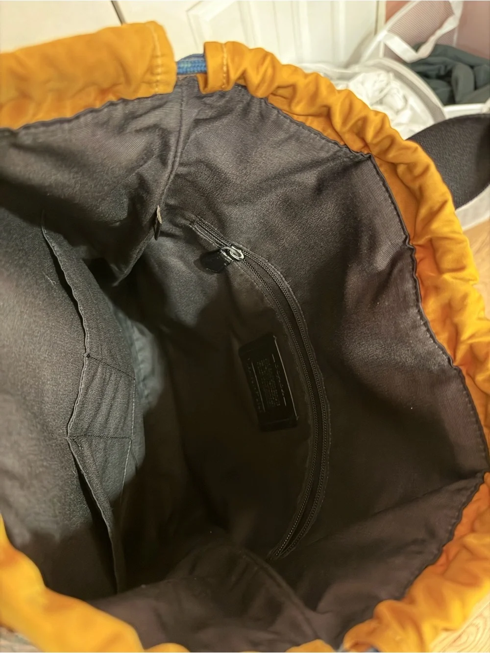 Coach Signature Logo Drawstring Backpack in Brown and Black